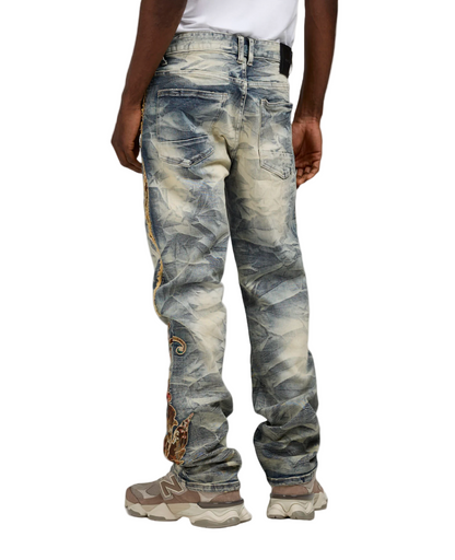 Distressed jeans worn by a person on a white background